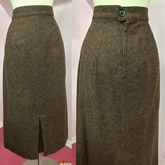 "Classic 1950s wool pinstriped skirt has brown background with brown and red pinstripes. Skirt is straight with pleat at front and metal zipper down the back. Skirt is unlined and appears to be house made by a accomplished seamstress. Excellent Condition  Fits Size Small  Waist 27\"  Hips @40\" Length 29\" Sweep 48\"" Fitted Wool Skirt In Brown, Fitted Brown Wool Skirt, Classic Brown Wool Skirt, Vintage Brown Wool Skirt, Brown Vintage Wool Skirt, Vintage Brown Skirt For Workwear, Vintage Brown Skirt For Work, Back Skirt, Brown Background