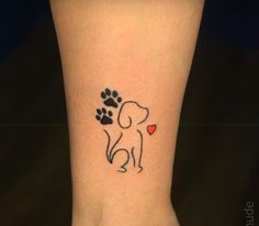 a small dog paw with a heart tattoo on the ankle