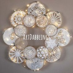 a white wreath with lights around it that says artabling