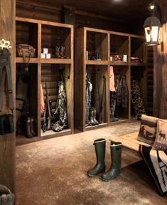 a room filled with lots of wooden shelves next to a bench and boots on the floor