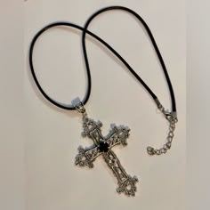 Handmade Antique Silver Tone Goth Cross Pendant Necklace Vintage Unisex Women Men Religious Gothic Grunge Punk Statement Floral Cross Pendant Hanging From An Adjustable Black Leather Choker Necklace. Necklace Length: 44cm + 5cm Extension Chain Cross Size: 7x5cm. Cross Material: Zinc Alloy * Ready To Ship Next Day * If You Are Interested In More Than One Item From My Store Please Message Me To Make A Bundle For You With Combined Shipping. Tags: Lightweight Silver Plated Charms Vintage Large Cross Goth Jelewery, Cross Necklace Goth, Grunge Cross Necklace, Pretty Cross Necklace, Silver Grunge Jewelry, Goth Cross Necklace, Y2k Cross Necklace, Black Accessories Jewelry, Cross Necklace Aesthetic