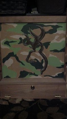 a camo dresser with an antelope on it