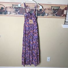 Abel The Label Sz S Lilac Dream Purple Smocked Floral Ruffled Maxi Dress Flowy Purple Midi Dress With Smocked Bodice, Purple Brunch Dress With Smocked Back, Purple Dress With Smocked Back For Brunch, Purple Midi Length Sundress For Vacation, Casual Purple Floral Print Maxi Dress, Casual Purple Floral Print Midi Dress, Casual Purple Floral Print Sundress, Purple Tiered Dress With Floral Print, Casual Printed Purple Maxi Dress