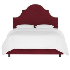 a bed with a red headboard and white sheets on it's sides, in front of a white background