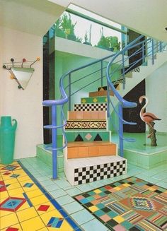 an artistically designed stair case in a modern home with tiled floors and colorful tiles on the floor