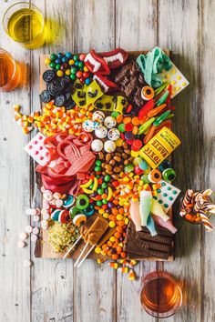 an assortment of candy and candies on a wooden table