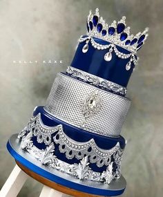 a stack of blue and silver wedding cakes on top of each other in different designs