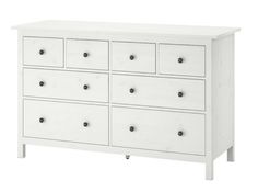 a white dresser with six drawers and two doors