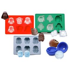 an assortment of chocolates and candy molds on a white background