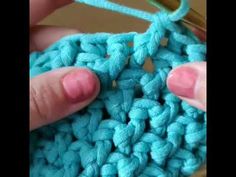 someone is crocheting the stitchs together