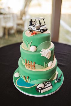 a three tiered cake is decorated with green frosting and golf themed fondant