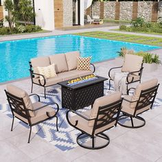 an outdoor patio furniture set near a swimming pool with lounge chairs and fire pit in the middle