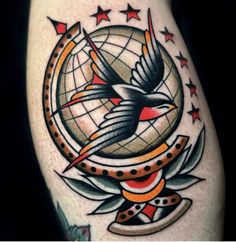 a tattoo with a bird on it and stars around the globe in the background,