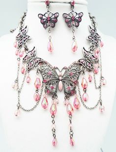 DESIGNER INSPIRED BOUTIQUE  17 in PINK A/B MULTI CRYSTAL  ENAMEL MULTI BUTTERFLY JEWELERY SET NEW Up for your consideration is a PINK multi crystal unique filigree Multi Butterfly Necklace and Earrings Jewelry Set. ALL SET IN SILVER-TONE METAL Butterfly Necklace measures 13 in with a 4 in metal center station Butterfly 3 1/2 in by 2 in with crystal drops French Wire Hook pierced Earrings measure 2 in by just under  1 in Great gift Idea. Please ask all questions prior to ordering! Butterfly Necklace And Earrings, Serah Farron, Gothic Jewelry Diy, Otherworldly Beauty, Outfit Pieces, Grunge Accessories, Whimsical Jewelry, Fairy Jewelry, Metal Butterfly