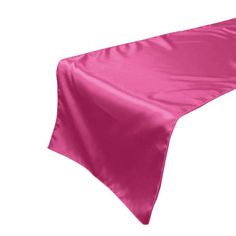 a pink satin table runner on a white background