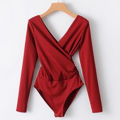 This long sleeve bodysuit featuring a plunging v-neck is the perfect item to bring you look together. Pair with jeans, leggings, skirt or shorts ... so be sure an visit our bottoms collection to find the perfect partner. Made with a polyester & cotton blend and comes in 6 fab colors. Long Sleeve Bodysuit Women, Black Backless Jumpsuits, Solid Jumpsuit, Backless Bodysuit, Backless Jumpsuit, V Neck Bodysuit, Chic Top, White Bodysuit, Basic Long Sleeve