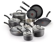 an assortment of pots and pans on a white background with the lids down,