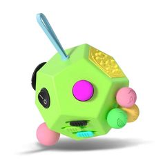 a green toy with pink and yellow balls on it's face, in front of a white background