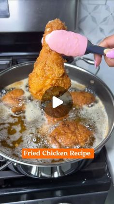 fried chicken is being cooked in a frying pan