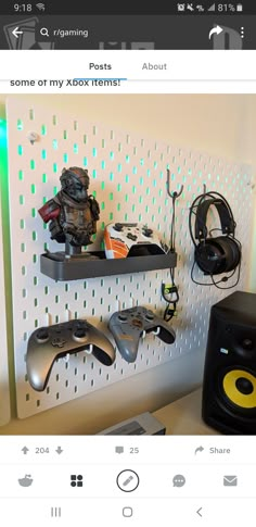 there are some video game controllers and headphones hanging on the wall next to each other