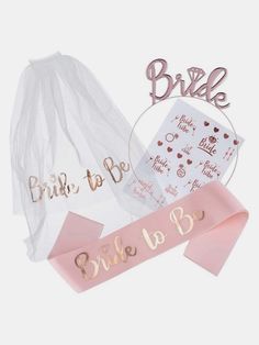 the bridal sash and bride to be sign are on display in front of each other