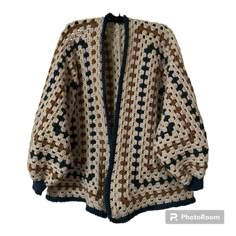 a crocheted jacket is shown on a white background with blue and brown accents