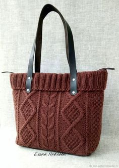 a brown knitted bag with leather handles