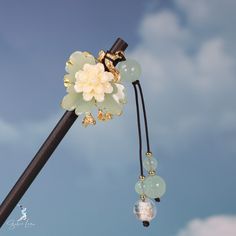 Elevate your hair game with our beautiful Japanese jade flowers wooden hair stick! Made with authentic Japanese jade, this hair stick will add a touch of elegance and charm to any hairstyle. Say goodbye to boring hair accessories and hello to a unique and stylish look. Enhance your beauty with our Japanese jade flowers wooden hair stick today! Materials: wood, jade stones, resin, alloy metal Jewelry Care: See more information about how to care for your jewelry here. Shipping Policy: Orders will Chinese Jewelry, Boring Hair, Enhance Your Beauty, Silver Jewelry Earrings, Hair Stick, Fashion Jewelry Earrings, Brooches Handmade, Jade Stone, Hair Game