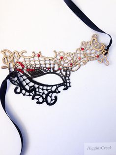 Masquerade Ball Masks Custom made and embellished to match your formal masquerade Party dress or costume. Intricately designed in the half face shape. All Masks come with either matching Ribbons or Stretched Lace. Base Material - Embroidered Lace Mask. All Masks come with either matching Ribbons or Stretched Lace. You may leave a note during checkout if you have a preference. Mask is available in left eye or right eye covered mask. You can leave a note during check out if you have a preference. Fantasy Halloween Masks For Gift, Fantasy Style Halloween Masks As Gifts, Fantasy Halloween Masks As Gifts, Adjustable Masquerade Mask For Costume Party, Adjustable Masquerade Mask Costume Accessories, Handmade Halloween Masks As Gifts, Black Masquerade Mask For Halloween Gift, Handmade Halloween Masquerade Mask For Party, Handmade Gothic Masks For Halloween Party