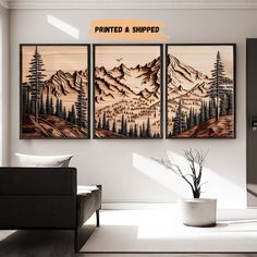 three paintings hanging on the wall in a living room