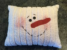 a pillow that has been made to look like a snowman's face on it