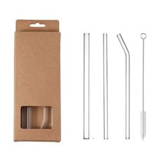 an open cardboard box with two metal straws and three stainless steel drinking straws