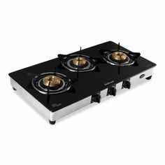 three burner gas stove with gold knobs