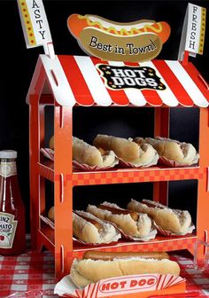 hot dogs are on display at a hot dog stand