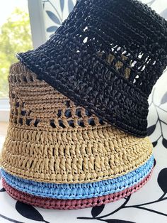 The raffia crochet bucket hat is the epitome of a versatile summer accessory. With its lightweight and breathable design, it effortlessly transitions from a chic sun hat for lounging by the beach to a practical straw gardening hat for tending to your plants with style. Its intricate crochet pattern adds a touch of bohemian charm, making it a fashionable choice for any summer outing. Either you're strolling through the farmer's market or enjoying a picnic in the park, this knit bucket hat provides both sun protection and a laid-back, slouchy vibe, ensuring you stay cool and stylish all season long. Color: multiple One size Materials: raffia Processing time: Up to 5 business days Delivery time: 7-14 business days Personalization: I can create a product according to your wishes, in the desire Spring Straw Bucket Hat, Vacation Bucket Hat With Woven Detail, Woven Summer Bucket Hat, Spring Bucket Straw Hat, Summer Bucket Hat In Straw, Casual Straw Bucket Sun Hat, Woven Bucket Hats For Summer, Spring Bucket Hat For Beach, Summer Bucket Hats For Beach Season