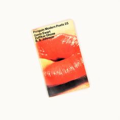 a close up of a magazine cover with red lipstick on the front and bottom of it