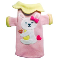 a pink and yellow dog coat with a white bear on it's chest, holding a heart