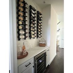 the wine rack is on the wall above the stove