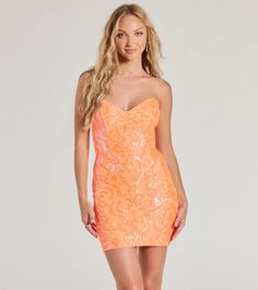 The Lilian mini dress is accented with a luxe sequin embroidered scroll pattern on lined mesh fabric for gorgeous glamour. The short dress features a V-neckline, a lace-up back that turns heads, and a figure-hugging bodycon silhouette. Perfect for a school dance or birthday!Fit & FeaturesSequin scroll patterned mesh fabric lined with stretchy knitStrapless V-necklineFlexible boning at the bodiceLace-up back, lower zipper with hook-eye closureMini-length bodycon silhouetteRuns true to size Orange Cocktail Dress, Orange Homecoming Dresses, Orange Cocktail Dresses, Birthday Fit, Purple Homecoming Dress, Backless Dress Short, Green Homecoming Dresses, Beach Wedding Guest Dress, Lace Dress Styles