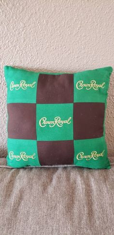 "Pillow made from Crown Royal apple (green) bags and dark brown fabric.  Back of pillow is of coordinating green fabric. Pillow measures approximately 12\" x 12\"." Crown Royal Bag Curtains, Quilts From Crown Royal Bags, Crown Royal Bag Quilt Ideas, Crown Royal Pillow Pattern, Crown Royal Bag Quilt, Crown Royal Apple, Dark Brown Fabric, Crown Royal Bags, Green Bags