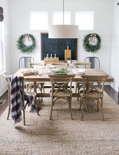 the dining room table is set for dinner