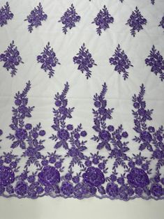 purple flowers on white sheer lace fabric