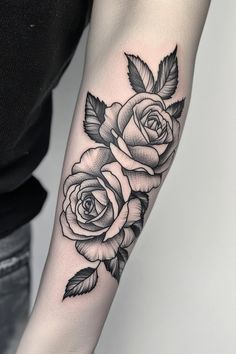 Two black and gray roses tattooed on a forearm. Womens Forearm Sleeve, Rose Arm Tattoos For Women Forearm, Rose Floral Tattoo Design, Men’s Rose Tattoo, Arm Tattoo Rose, Large Rose Tattoo, Rose Tattoo Design For Men, Rose Bush Tattoo, Rose Tattoo Black And Grey