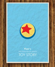 the poster for pixar's toy story is displayed on a wooden surface