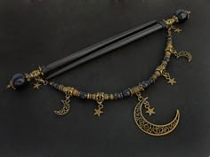 "Set of two beautiful hair sticks with blue goldstone (know also as sandstone / stellaria / night of Kairo) round beads in various sizes. Along with two hair sticks, there is a beautiful, long REMOVABLE pendant / chain - which gives you more possibilities to create beautiful up-do. Chain is decorated with moons and stars. If you're not currently into connected hair sticks, you can simply take off the pendant. * Total length: 17,6cm / 6,9\" * Usable length: 13,5cm / 5,3\" * Pendant length: 19,5cm Wooden Hair Sticks, Japanese Kanzashi, Estilo Hippie, Japanese Hairstyle, Magical Jewelry, Blue Goldstone, Fantasy Jewelry, Diy Schmuck, Hair Sticks