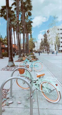 there are many bicycles parked on the sidewalk