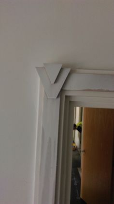 the corner of a door frame is painted white