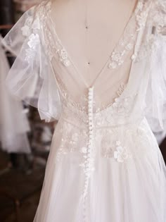 the back of a wedding dress on display