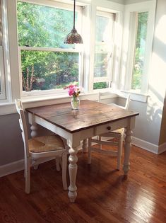 a wooden table sitting in the middle of a room