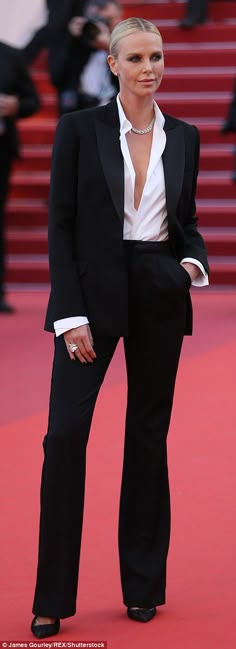 Charlize Theron looks phenomenal in androgynous trouser suit as ex Sean Penn walks the red carpet with his daughter Dylan at the star-studded The Last Face screening in Cannes | Daily Mail Online Woman In Suit, Kitchen Carpet, Power Dressing, Woman Suit Fashion, Prom Outfits, Black Suit, Charlize Theron, 가을 패션, Red Carpet Dresses